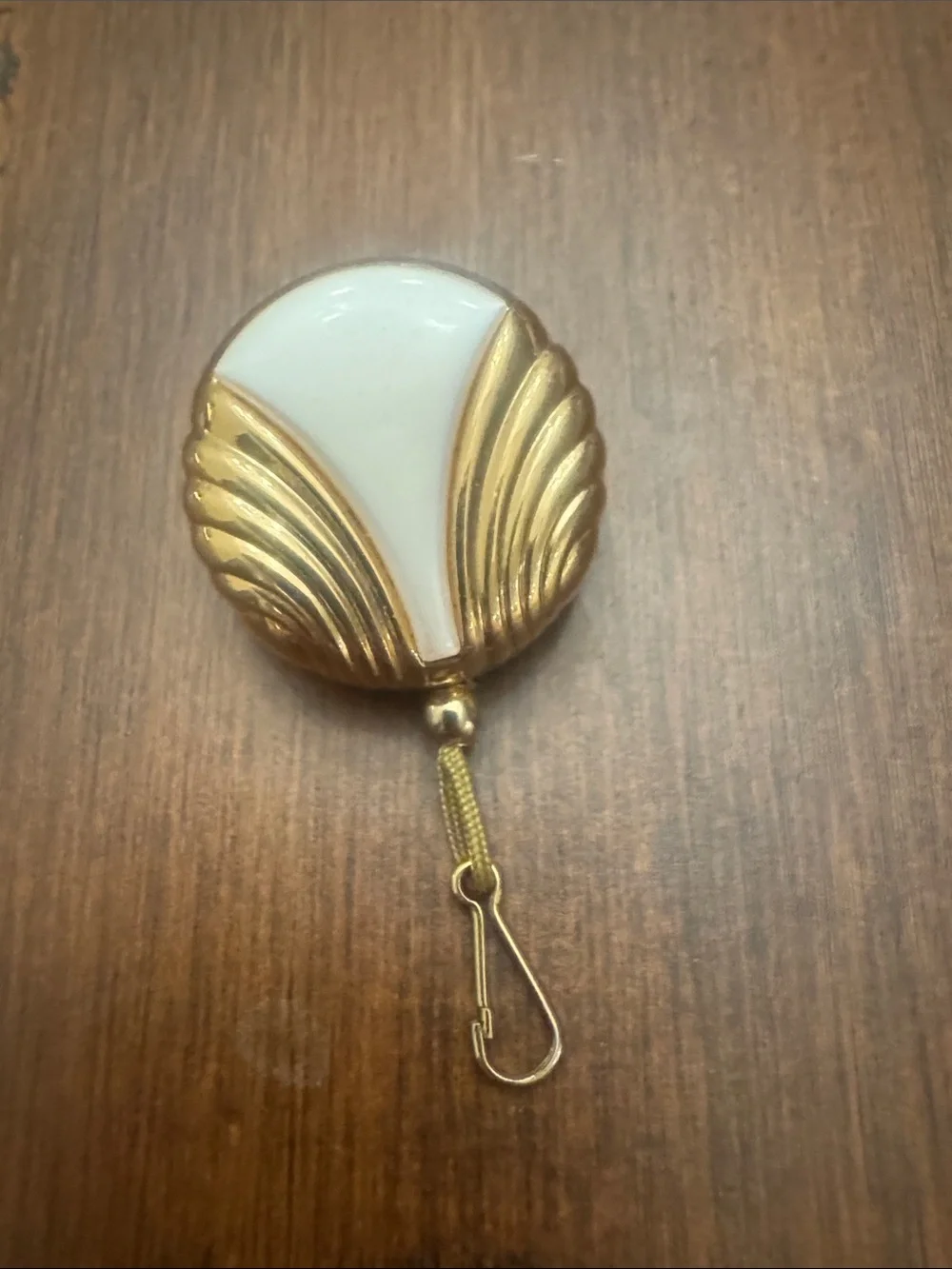 Vintage Avon Gold and White Shielded Badge Reel-retractable gold pull never used